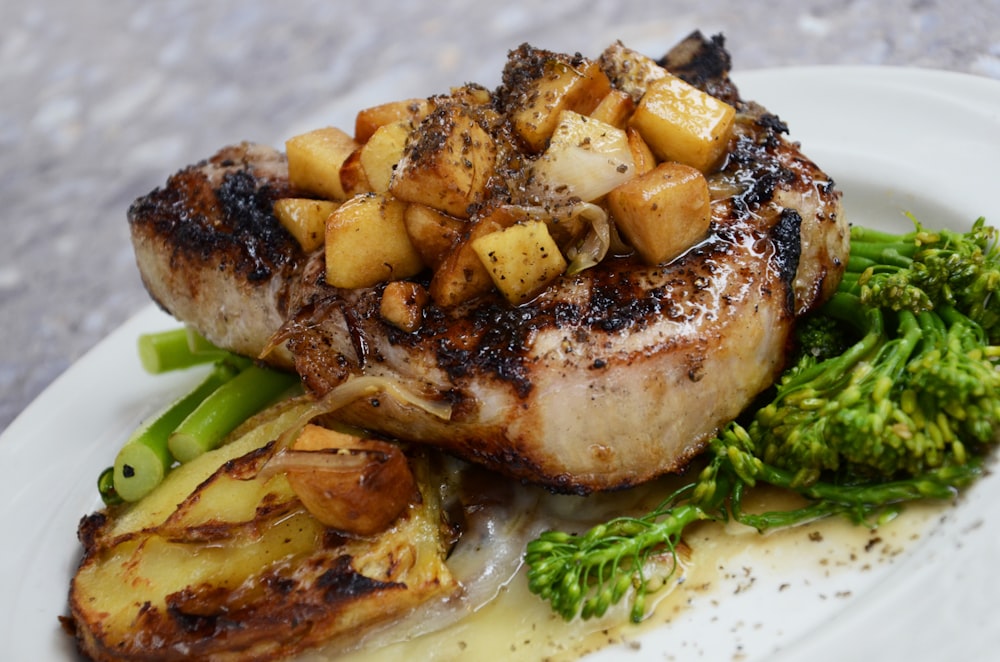 Seared pork belly plated with roasted vegetables